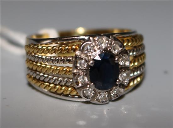 A gold sapphire and diamond ring